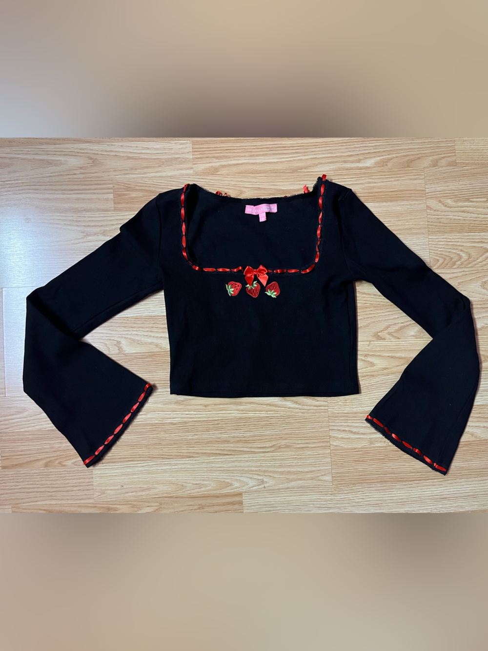 Dolls Kill x Strawberry Shortcake Black Cropped Long-Sleeve Top with Red Trim